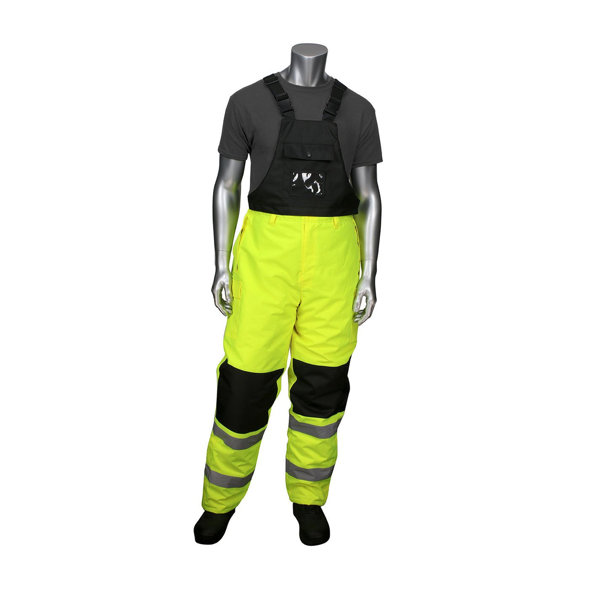 The mannequin showcases winter workwear from PIP - Protective Industrial Products, featuring the PIP Insulated Bib Pants with Black Trim 318-1775. These bright yellow overalls are enhanced with reflective stripes and black knee patches, complemented by a dark gray T-shirt against a plain white background to ensure safety and warmth on the job.