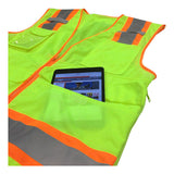 The PIP Hi-Vis Yellow Pocket Surveyors Tech Vest 302-0700LY features orange and silver reflective stripes and a large pocket with a tablet partially visible inside.