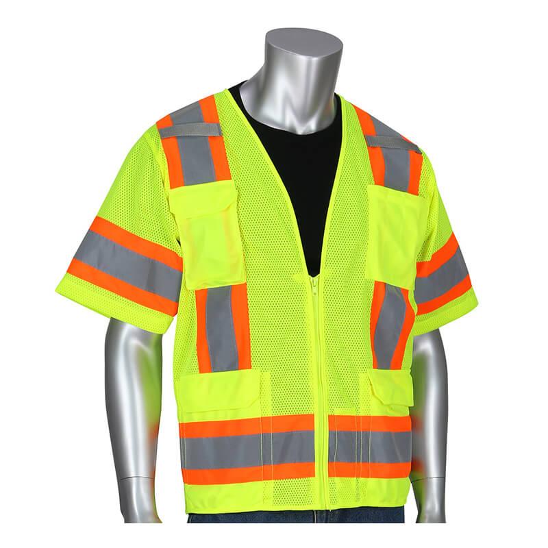 A silver mannequin showcases the PIP Lime Yellow Two Tone Surveyor 11 Pocket Vest Class 3 in bright lime yellow with orange and reflective gray stripes, worn over a black shirt. This ANSI Class 3 vest features two large pockets on the front. The mannequin stands against a plain white background, emphasizing the vest's striking design.
