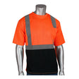 The mannequin is dressed in a PIP Class 2 UV Black Bottom Crew Neck T-Shirt 312-1250B-OR. This vibrant orange and black Hi-Vis workwear, made from moisture-wicking polyester, features reflective gray stripes to ensure ANSI Class 2 visibility and comfort at work.