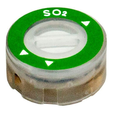 The RKI Replacement SO2 Sensor ESR-A13D-SO2 by RKI Instruments is a round, transparent sensor with a green label marked "SO₂" and small white arrows. It belongs to the SC-04 Series and features a central opening along with a translucent casing, making it perfect for devices such as the GX-3R Pro gas monitor.