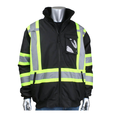 Displayed on a mannequin is the PIP Two-Tone X-Back Full Zip Bomber Jacket 331-1745X by Protective Industrial Products, a standout among high visibility jackets. It features bright yellow and silver reflective tape against its black fabric, ensuring safety. The design includes a zip-up front and a chest pocket for practicality.