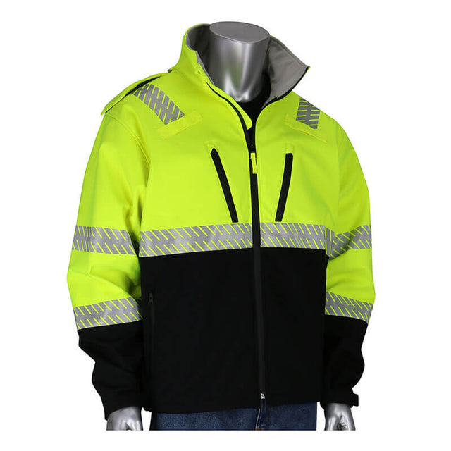 The PIP Ripstop Softshell Black Bottom Jacket, by Protective Industrial Products, is a high-visibility yellow and black waterproof jacket designed for safety. Displayed on a silver mannequin, it comes with reflective tape on the sleeves, chest, and shoulders. This jacket features front pockets and a high collar while being fully zipped for optimal protection.