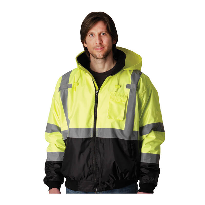 A man wears a PIP Waterproof Reflective Value Bomber Jacket 333-1766 in yellow and black with silver reflective stripes (ANSI Class 3) by PIP, standing against a plain white background.