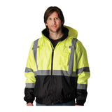 A man wears a PIP Waterproof Reflective Value Bomber Jacket 333-1766 in yellow and black with silver reflective stripes (ANSI Class 3) by PIP, standing against a plain white background.