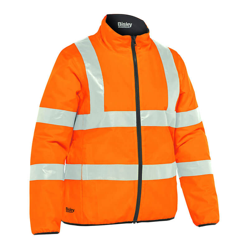 This PIP Bisley ANSI Type R Class 3 Women's Reversible Puffer Jacket combines safety and style with its hi-vis orange color and reflective silver stripes. Featuring a front zipper and stand-up collar, it proudly displays the PIP logo, ensuring both visibility and fashion in one ideal piece.