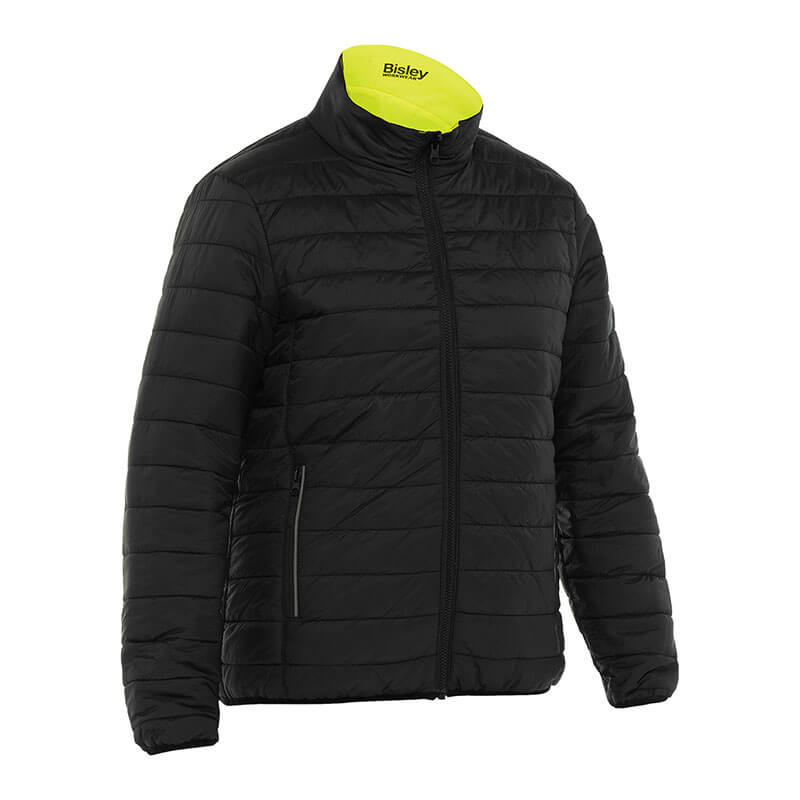 This women's reversible puffer jacket by PIP, available in a quilted black design with a high collar and vibrant yellow lining, includes a front zipper and two side pockets. The Bisley branding is visible on the inside of the collar, adding to its high visibility appeal.