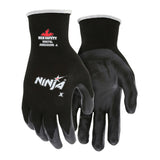 MCR Safety Ninja X Professional Grade Glove N9674, black with white cuff trim, offers superior grip with coated palm and fingers. Features the MCR Safety logo and abrasion rating. Sold as a pack of 12 pairs.