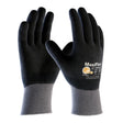 A pair of PIP MaxiFlex Ultimate Fully-Coated Micro-Foam Grip Glove 34-876 (12 pairs) in black and gray is shown upright, featuring the brand name and logo on the back of one abrasion resistant glove.