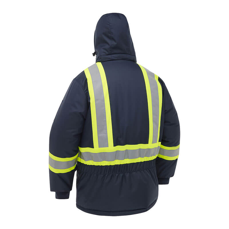 A person seen from the back is wearing a PIP Bisley Navy Extreme Cold Jacket 341M6460H, a dark blue waterproof work jacket with high-visibility yellow and silver reflective stripes.
