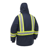 A person seen from the back is wearing a PIP Bisley Navy Extreme Cold Jacket 341M6460H, a dark blue waterproof work jacket with high-visibility yellow and silver reflective stripes.