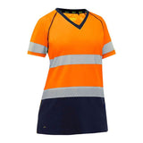 The PIP Bisley Women's Short Sleeve T-Shirt with Navy Bottom (312W1118T) is a safety shirt in bright orange and navy, featuring reflective gray stripes across the chest and midsection. It is designed as ANSI Class 2 Hi-Vis Apparel with a V-neck style, showcasing the brand "PIP - Protective Industrial Products" on the inner collar.