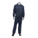 A metallic mannequin stands upright in a dark blue PIP AR/FR Dual Certified Economy Coverall 9100-2000E from Protective Industrial Products, complete with a collar and long sleeves, and paired with black boots. This dual-certified ensemble, featuring an impressive ARC rating, emphasizes safety against the pristine white background without any facial features.