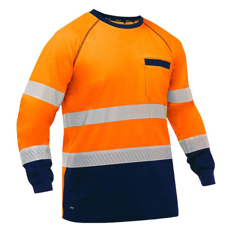 The PIP Bisley Long Sleeve Shirt w/Navy Bottom 313M6118T, by Protective Industrial Products, is designed in bright orange and navy blue. It features silver reflective tape stripes across the chest, arms, and cuffs. Enhanced with antimicrobial treatment, it also includes a convenient left chest pocket for added utility.