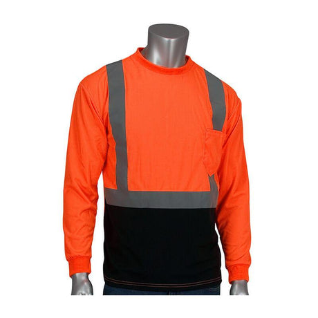 A mannequin displays the PIP ANSI Type R Class 2 Black Bottom Shirt w/50+ UPF 312-1350B by Protective Industrial Products, featuring a hi-visibility orange color, long sleeves, ANSI/ISEA 107 Class 2 reflective gray stripes, a small chest pocket, and a black lower section.