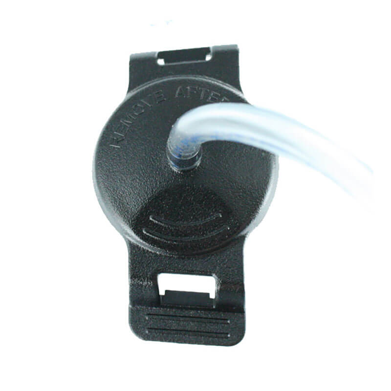 A close-up of the BW Honeywell Manual Aspirator Pump (MC-AS01) for GasAlertMicroClip, a black plastic circular accessory by BW Technologies, with a clear tube at the top center, slots on both ends, and raised text around the tube connection.