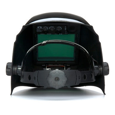 The LEADHEAD Auto Darkening Helmet WHAM3030GB by Pyramex Safety is a black welding helmet made from high-impact resistant nylon. It features an adjustable head strap and a dark green viewing lens. Inside, the helmet showcases an adjustment knob at the bottom for improved welding protection.