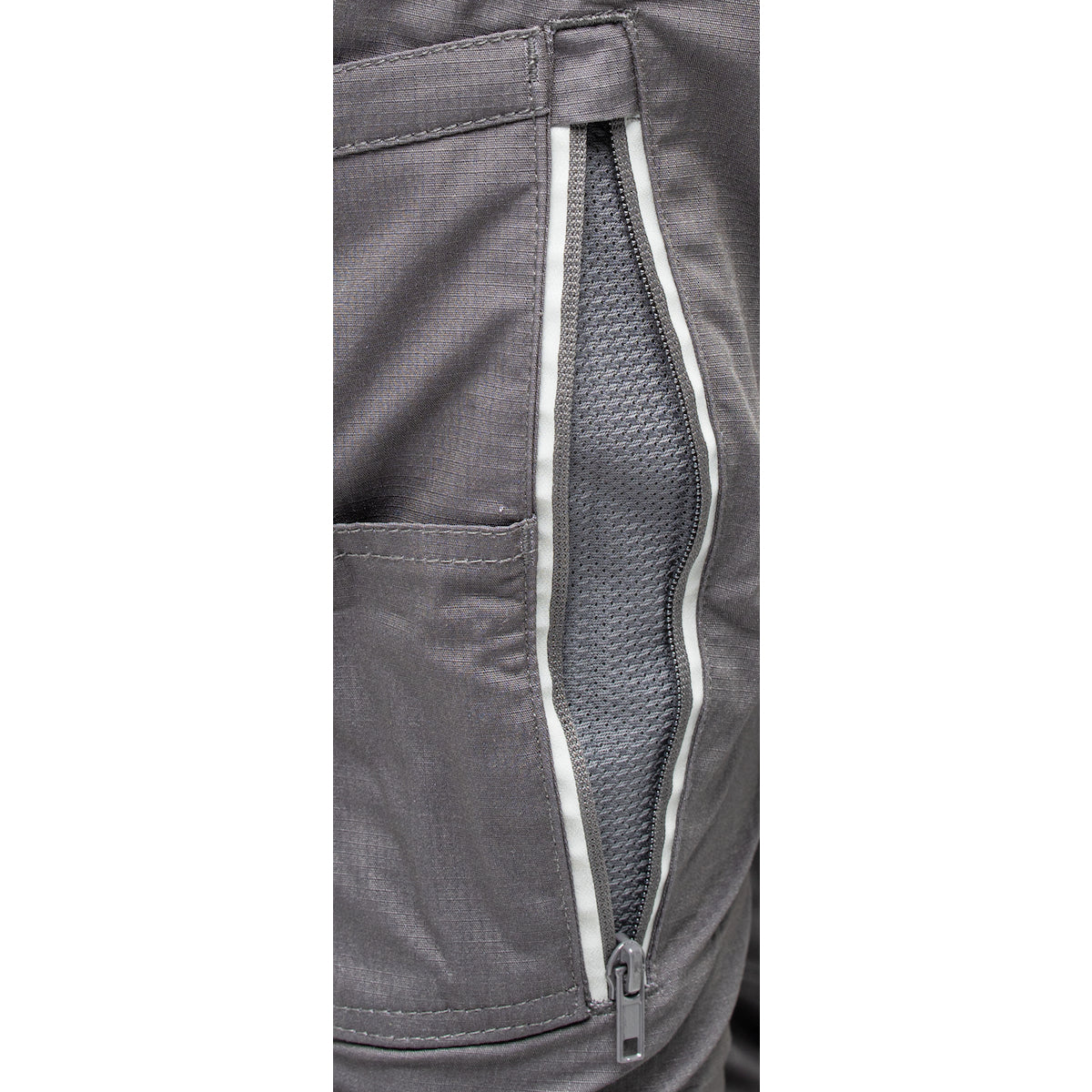 A close-up of a utility pocket on PIP Bisley Women's Stretch Ripstop Vented Work Pants by NSA showcases the grey fabric's slightly textured appearance. The pocket features a white zippered opening that reveals a mesh lining inside, highlighting the X-Airflow Ventilation.