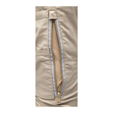 Close-up of a tan fabric with a vertical zipper partially open, revealing a mesh lining designed for X-Airflow Ventilation. The silver-colored zipper suggests this is part of the PIP Bisley Women's Stretch Ripstop Vented Work Pants by NSA, offering functionality and UPF 50+ protection.