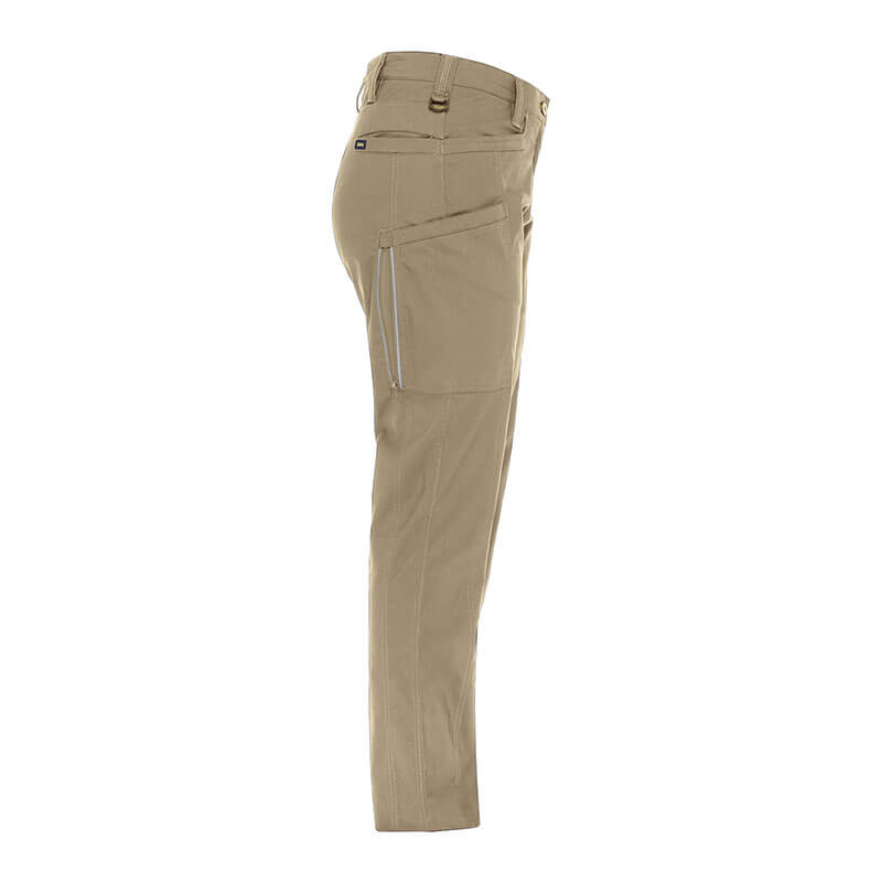 Side view of beige PIP Bisley Women's Stretch Ripstop Vented Work Pants by NSA, featuring multiple pockets, belt loops, and X-Airflow Ventilation, displayed on a plain white background.