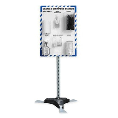 The AccuformNMC Clean & Disinfect Station with Stand PRF314 is a freestanding hygiene station featuring labeled sections for paper towels, sanitizer, gloves, spray, alcohol wipes, and disinfection supplies. It has a blue and white board with items neatly organized to ensure cleanliness and safety.