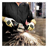 A person wearing SHOWA 4561 Cut Resistant Gloves by Showa Best operates an angle grinder, producing bright sparks. They are dressed in a black shirt against the backdrop of an industrial workspace.
