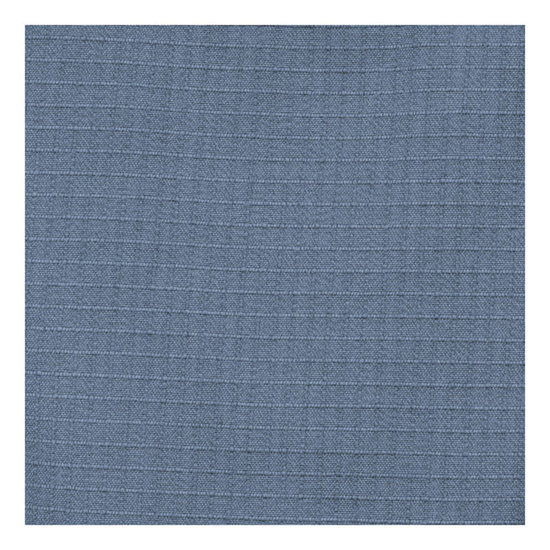 A close-up of the MCR Safety Summit Breeze 5.5 oz FR Shirt (SBS100_) shows its blue fabric with a subtle grid texture—thin horizontal and vertical lines engineered for superior arc flash protection.