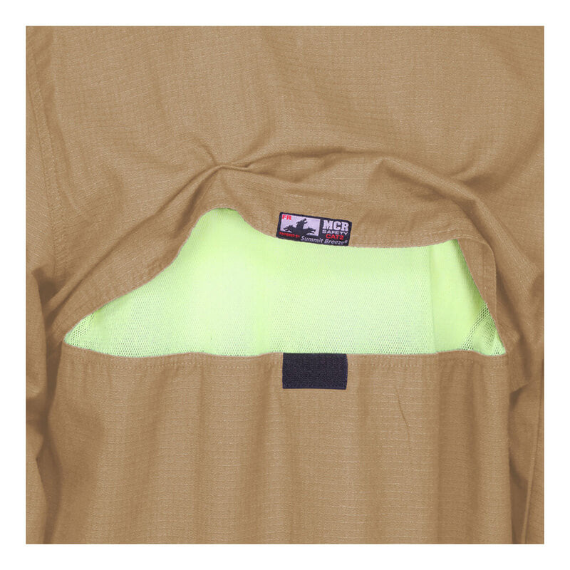 Close-up of a MCR Safety Summit Breeze 5.5 oz FR Shirt (SBS100_) pocket with flap partially open, showing yellow-green lining and an "MCR" label on the flap, emphasizing its arc flash protection features.