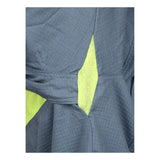 Close-up of the MCR Safety Summit Breeze 5.5 oz FR Shirt (SBS100_) fabric, showing gray textured grid pattern and bright yellow mesh panels, likely with triple vent tech for improved comfort in arc flash or sports environments.