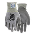 A pair of gray and white MCR Safety Memphis Dyneema Ultra-Tech Glove 9676 cut resistant gloves with safety ratings on the back, textured palms, and reinforced cuffs for protection—ideal for assembly work.