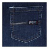 Close-up of MCR Safety FR Gear 10.5 oz Vintage Denim Jeans P2D featuring blue flame-resistant denim, yellow stitching, and a small "MCR Safety CAT 2" label on the pocket's upper right, showcasing their CAT2 protection.