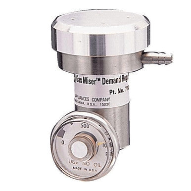 Close-up of an MSA Universal Demand Flow Regulator 10034391, showcasing its metallic cylindrical body with a pressure gauge, labeled "Use No Oil" and "Made in U.S.A." This MSA regulator is engineered for precise calibration gas flow control, ensuring accuracy for multigas detectors.