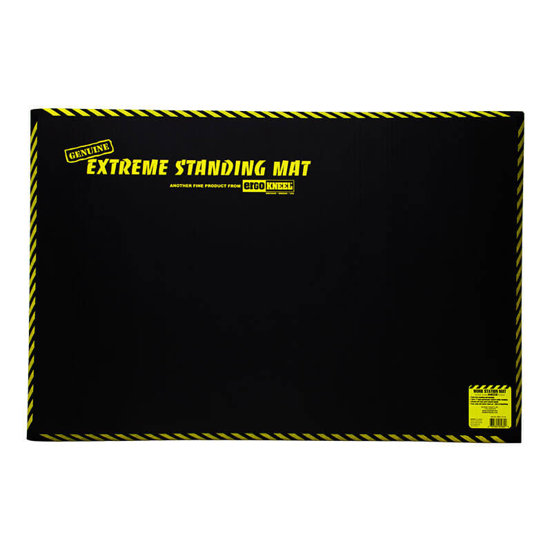 A 3 x 2 Ft. "Working Concepts ErgoKneel Extreme Standing Mat" featuring a black closed-cell foam pad with yellow text and caution stripes for comfort, designed as an anti-fatigue mat for prolonged standing.