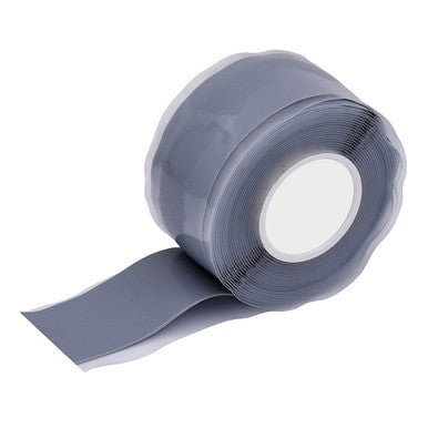 A roll of gray tape from the PIP Tool Tethering Kit 533-900101, with one end partially unrolled, is perfect for preventing dropped objects. This thick and durable tape is ideal for sealing or repairs and is neatly coiled around its central white core, making it an essential part of any tool tethering kit by Protective Industrial Products (PIP).