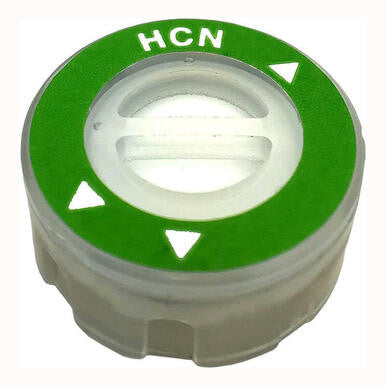 Close-up of a small, cylindrical plastic cap with a green top labeled "HCN" in white text, designed for HCN monitoring. The cap features three triangular white markers around a central circular opening and is compatible with the RKI Instruments Replacement HCN Sensor ESR-A13D-HCN for the GX-3R Pro.