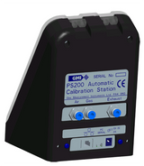 A digital illustration of a sleek, black Teledyne ABC Bump/Calibration Station 64052Q, ideal for the PS200 portable gas detector. The front panel features labels for air, gas, and exhaust with corresponding buttons and ports. The Teledyne Gas & Flame logo and serial number field are prominently displayed at the top.