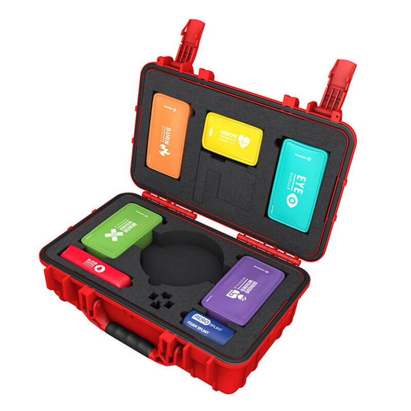 The Aero Healthcare Modulator Trauma Kit w/Bleed Control, M600-7 features an open red design showcasing a variety of colorful, labeled compartments for medical supplies, all secured in protective foam padding. The compartments are specifically labeled for burns, bites, eye care, minor wounds, and sprains. Additionally, it includes a specialized Bleed Control module equipped with a RapidStop Tourniquet.