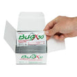 A hand holds a packet of Coretex BugX Insect Repellent Towelettes 100/Case 12640 above an open white box filled with multiple packets. The packaging, branded by Coretex, is white with green and red text, highlighting its effective water-based formula featuring Deet insect repellent.