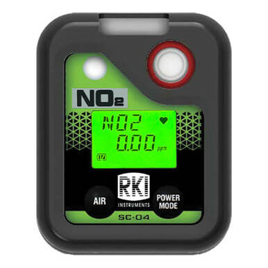 The RKI Instruments SC-04 Series NO2 Single Gas Monitor 73-0073 is a digital device with a stylish black and green design, displaying "NO2 0.00 ppm" on its screen. It features a power mode button and the RKI Instruments brand, making it ideal for intrinsically safe personal monitoring.