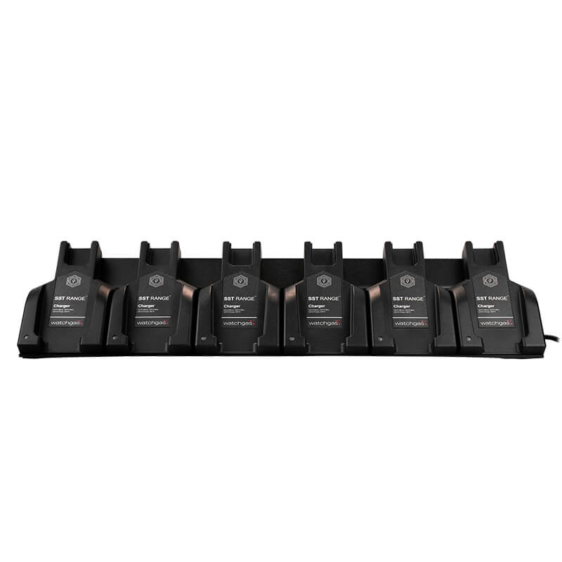 A WatchGas SST 6 Way Bench Top Charger (SST-6WSCC-KIT) holds six identical battery packs labeled “WatchGas” in a row. This centralized charging dock from WatchGas offers efficient six-device charging for streamlined power management, neatly arranged against a white background.