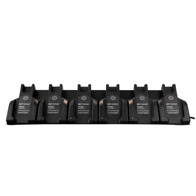A WatchGas SST 6 Way Bench Top Charger (SST-6WSCC-KIT) holds six identical battery packs labeled “WatchGas” in a row. This centralized charging dock from WatchGas offers efficient six-device charging for streamlined power management, neatly arranged against a white background.
