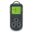 The Teledyne GMI Model PS200 4-Gas Detector 64041, a portable device featuring a digital screen, shows readings for oxygen, carbon monoxide, hydrogen sulfide, and combustible gases. This dark gray detector is equipped with buttons and sensor openings on the front to ensure reliable gas detection wherever it is needed.