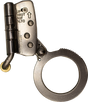 A close-up image of a single metallic handcuff, open to reveal its locking mechanism. The polished metal is reflective, with "UP" and "HAUT" engraved near the hinge, reminiscent of the precision seen in the French Creek Stainless Steel Rope Grab with Safety Lock 1201N by French Creek Production used for fall protection.