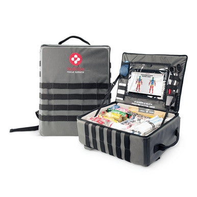 An open medical kit displays the ZOLL Mobilize Mobile Rescue System 8911-002000-01, containing essential emergency supplies such as bandages, scissors, and a guide. The gray kit features black straps and an easy-carry handle. In the background, a branded ZOLL bag stands closed, ready for swift emergency response.