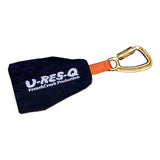 The French Creek Manually Deployed Self Rescue System R-RESC features a safety lanyard with a metal carabiner attached to a black pouch labeled "U-RES-Q French Creek Production." It is designed to mitigate suspension trauma and includes an orange strap connecting the pouch to the carabiner, adhering to ANSI Z359.1 standards for ultimate reliability.