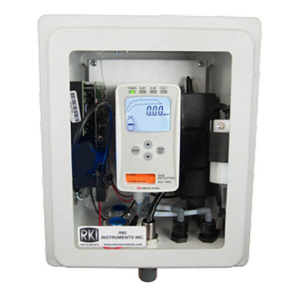 A white RKI Instruments GD-70D O2 gas detection device offers smart gas detection technology and includes a digital display showing "0.00." It features easy-to-use buttons, visible internal components through a clear panel, all housed in a sturdy NEMA 4X enclosure.