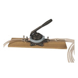 A manual diverter valve is mounted on a rectangular wooden board, featuring clear tubing and a black handle for operation, making it ideal for use with the UltraTech Bladder Pump 2345 by UltraTech International to facilitate efficient removal of spilled contents or connections to sumps.