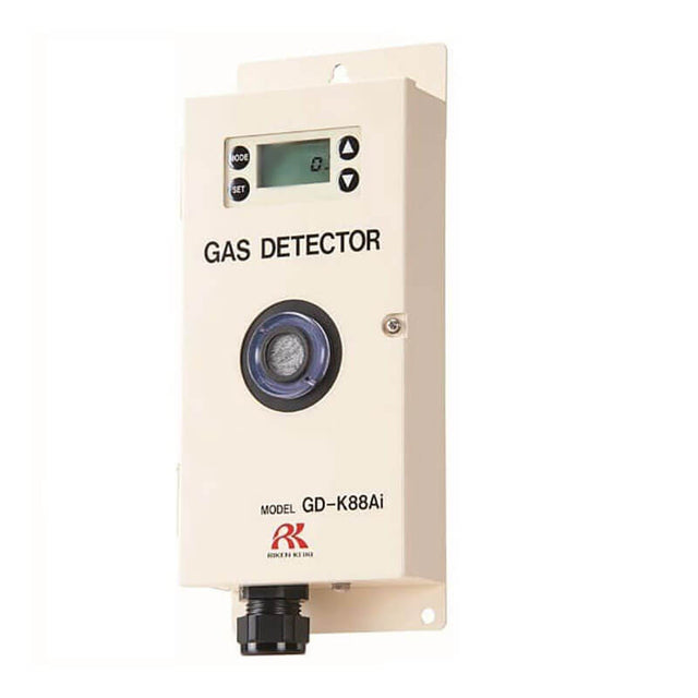 An image of the RKI Instruments GD-K88AI Diffusion Sensor/Transmitter for B2H6, a rectangular metallic gas detector featuring a diborane sensor. It includes a small digital display and control buttons on the front, along with intrinsic safety barriers for increased security. At the bottom, there's a circular sensor and connector.