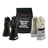 Displayed is a set of protective gloves featuring black rubber insulating gloves and white leather protector gloves on stands. A carrying bag with "NOVAX Always Wear Your Gloves" highlights the dependable PIP NOVAX Class 1 Electrical Safety Kit 150-SK-1 by PIP - Protective Industrial Products in the background.