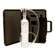 Displayed in front of an open black carrying case with custom foam padding, tailor-made for the RKI GX-2012 Calibration Kit by PK Safety Supply, is a silver gas cylinder featuring a pressure gauge and attached tubing. The case includes a handle on the right side to facilitate easy transport.